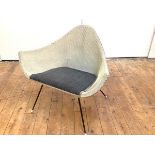 A 1950's 'Satelite' armchair, in the manner of Lloyd Loom, the woven triangular frame with pad seat,