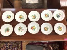 A set of ten Meissen fruit-painted dessert plates, 20th century, each decorated to the well with