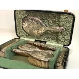 An Edwardian silver-mounted cased dressing table set, Walker & Hall, various dates, Chester 1906 and