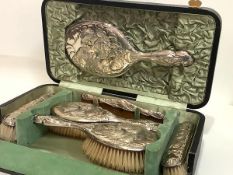 An Edwardian silver-mounted cased dressing table set, Walker & Hall, various dates, Chester 1906 and