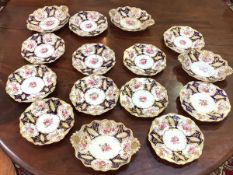 A mid-19th century English dessert service, possibly Minton, comprising eleven plates and four