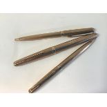 Parker: a set of three 9ct gold pens comprising fountain pen, ballpoint pen and propelling pencil,