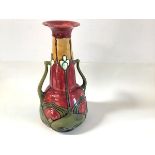 A Minton Secessionist No. 8 twin-handled vase, painted in a palette of red, green and mustard,