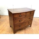 A small early 19th century mahogany bowfronted chest of drawers, with two short over two long