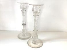 A pair of Regency cut-glass candlesticks, early 19th century, each with thumb-cut baluster candle-