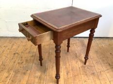 A Victorian walnut writing desk of neat proportions, the rectangular top inset with a tooled leather