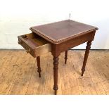 A Victorian walnut writing desk of neat proportions, the rectangular top inset with a tooled leather