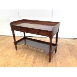 A William IV mahogany washstand, with three quarter gallery, pair of frieze drawers, raised on