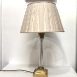 A modern brass and glass Corinthian columnar table lamp, with fluted glass column, on a square