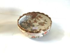 A Satsuma bowl, early 20th century, with scalloped rim, painted to the interior and exterior with
