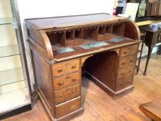 A mid-19th century mahogany Estate or Rent desk, the cylinder top enclosing a fitted interior of