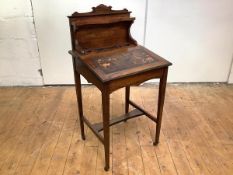An Edwardian rosewood and boxwood-lined writing desk of small proportions, the raised gallery with