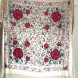 A Chinese embroidered silk lady's evening shawl, early 20th century, worked in polychrome threads