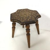 An early 20thc pokerwork stool, the top with concave corners, on four turned tapering supports, with