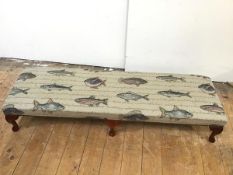 A modern long footstool upholstered with fish design, on cabriole legs ending in pad feet (24cm x