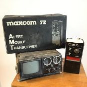A Crown portable television, FM/AM2 band radio (10cm x 28cm x 24cm) and a Maxcom 7E Alert Mobile