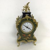 A rococo inspired mantle clock with flame finial, dial marked Imperial, made in Italy, on C scroll