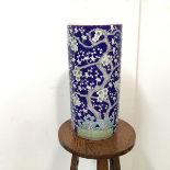 A modern Chinese umbrella stand with prunus decoration (47cm x 21cm)