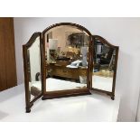 A 1930s mahogany triptych dressing table mirror each panel with bevelled glass (fully open: 56cm x