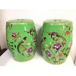 A pair of modern Chinese inspired ceramic verandah stools with pierced rice pattern panels,