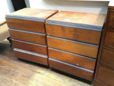 A pair of teak chests of drawers, each fitted four drawers, on plinth bases (a/f) provenance: Heriot