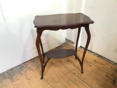 A reproduction occasional table with serpentine top, the cabriole legs united by undertier and