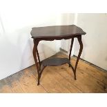 A reproduction occasional table with serpentine top, the cabriole legs united by undertier and