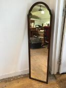 A 1920s wall mirror with domed top (126cm x 34cm)
