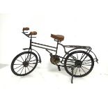 A metal and wood model of a Bicycle with functional pedals and chain (28cm x 51cm x 14cm)