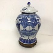 A Chinese blue and white jar of baluster form with an unassociated lid, with six character marks