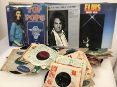 A quantity of vinyl records including 45s, including Elvis, Rick Wakeman, The Glen Miller Band