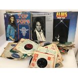 A quantity of vinyl records including 45s, including Elvis, Rick Wakeman, The Glen Miller Band