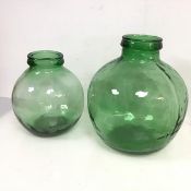 A green glass carboy (h.35cm x d.32cm) and another smaller, both marked Viresa to rim