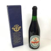 A 1985 bottle of Tennants Centenary lager with original box (h.30cm) (a/f)