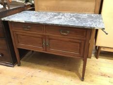 An Edwardian mahogany washstand with marble top (a/f), above two short drawers and a two door