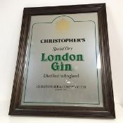 A pub mirror inscribed Christopher's Special Dry London Gin, with Royal Warrant (58cm x 46cm)