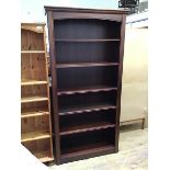 A modern mahogany open bookcase fitted five adjustable shelves (195cm x 97cm x 33cm)