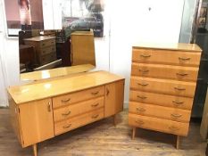 A mid century satinwood birch two piece bedroom suite comprising a tallboy chest of six long