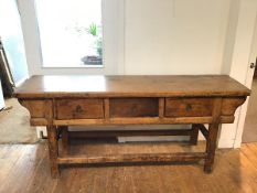 A Chinese altar table, with plank top over three drawers, on moulded supports (81cm x 194cm x 50cm)