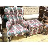 An easy chair upholstered in Liberty of London fabric, on turned front supports along with a