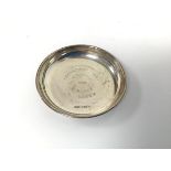 A Birmingham silver ashtray inscribed Galloway Cup Winners, C. Blake & S. Leszek, 1988 (d.8cm) (50.