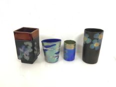 A collection of four Margery Clinton ceramic vases including a square vase with lustre edge and