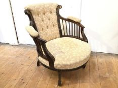 An Edwardian tub chair with foliate inlay, re- upholstered foliate fabric, on tapering front