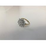 A 9ct gold dress ring, set with a cluster of colourless stones (O) (2.99g)