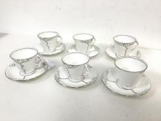 A set of six Flosmaron tea cups of conical form, complete with matching saucers, all with tree