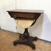 A William IV rosewood work table fitted single frieze drawer above a work basket (a/f), on faceted