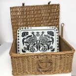 A wicker picnic basket (23cm x 50cm x 39cm) and a metal tray with bird design (2)