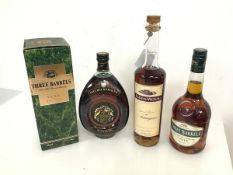 A bottle of Jean du Vignau armagnac, two bottles of Three Barrels brandy, one in original box and