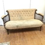 An Edwardian sofa with foliate inlay and modern foliate upholstery on front tapering supports ending