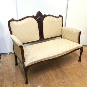 A reproduction sofa with central pierced splat flanked by upholstered panels, with slightly